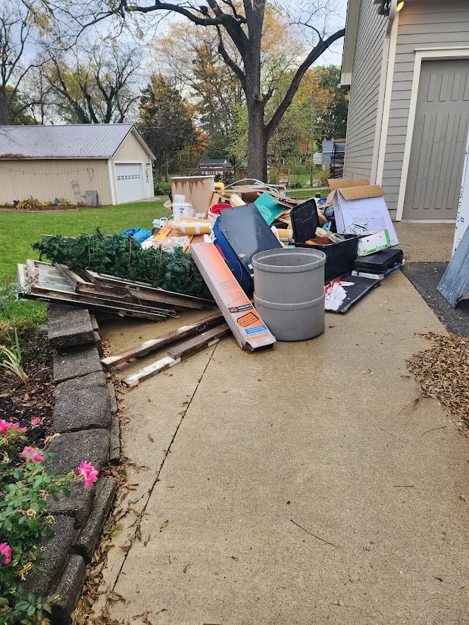 Dumpster being loaded with debris for 3 Yard Dumpster Rental in Montgomery Village